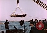 Image of Iwo Jima wounded hoisted onto LST Iwo Jima, 1945, second 37 stock footage video 65675029321
