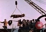 Image of Iwo Jima wounded hoisted onto LST Iwo Jima, 1945, second 40 stock footage video 65675029321