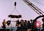 Image of Iwo Jima wounded hoisted onto LST Iwo Jima, 1945, second 41 stock footage video 65675029321
