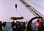 Image of Iwo Jima wounded hoisted onto LST Iwo Jima, 1945, second 43 stock footage video 65675029321