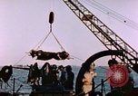 Image of Iwo Jima wounded hoisted onto LST Iwo Jima, 1945, second 44 stock footage video 65675029321