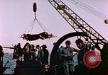 Image of Iwo Jima wounded hoisted onto LST Iwo Jima, 1945, second 46 stock footage video 65675029321