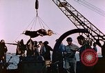 Image of Iwo Jima wounded hoisted onto LST Iwo Jima, 1945, second 47 stock footage video 65675029321