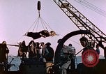 Image of Iwo Jima wounded hoisted onto LST Iwo Jima, 1945, second 48 stock footage video 65675029321