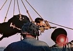 Image of Iwo Jima wounded hoisted onto LST Iwo Jima, 1945, second 50 stock footage video 65675029321