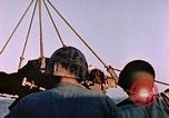 Image of Iwo Jima wounded hoisted onto LST Iwo Jima, 1945, second 51 stock footage video 65675029321