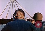 Image of Iwo Jima wounded hoisted onto LST Iwo Jima, 1945, second 52 stock footage video 65675029321