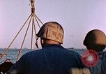 Image of Iwo Jima wounded hoisted onto LST Iwo Jima, 1945, second 53 stock footage video 65675029321
