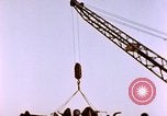 Image of Iwo Jima wounded hoisted onto LST Iwo Jima, 1945, second 57 stock footage video 65675029321