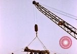 Image of Iwo Jima wounded hoisted onto LST Iwo Jima, 1945, second 58 stock footage video 65675029321