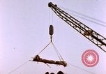 Image of Iwo Jima wounded hoisted onto LST Iwo Jima, 1945, second 60 stock footage video 65675029321