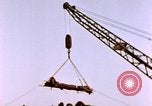 Image of Iwo Jima wounded hoisted onto LST Iwo Jima, 1945, second 61 stock footage video 65675029321