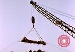 Image of Iwo Jima wounded hoisted onto LST Iwo Jima, 1945, second 62 stock footage video 65675029321