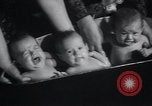 Image of triplets Chicago Illinois USA, 1932, second 30 stock footage video 65675029419