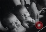 Image of triplets Chicago Illinois USA, 1932, second 33 stock footage video 65675029419