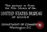 Image of drawing steel rod through die into wires at factory United States USA, 1924, second 4 stock footage video 65675029554