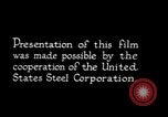 Image of drawing steel rod through die into wires at factory United States USA, 1924, second 25 stock footage video 65675029554