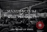 Image of drawing steel rod through die into wires at factory United States USA, 1924, second 31 stock footage video 65675029554