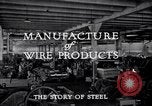 Image of drawing steel rod through die into wires at factory United States USA, 1924, second 32 stock footage video 65675029554