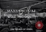Image of drawing steel rod through die into wires at factory United States USA, 1924, second 33 stock footage video 65675029554