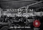 Image of drawing steel rod through die into wires at factory United States USA, 1924, second 35 stock footage video 65675029554