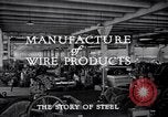 Image of drawing steel rod through die into wires at factory United States USA, 1924, second 36 stock footage video 65675029554