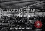 Image of drawing steel rod through die into wires at factory United States USA, 1924, second 37 stock footage video 65675029554