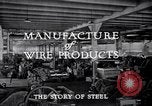 Image of drawing steel rod through die into wires at factory United States USA, 1924, second 38 stock footage video 65675029554