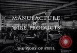 Image of drawing steel rod through die into wires at factory United States USA, 1924, second 39 stock footage video 65675029554