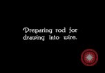 Image of drawing steel rod through die into wires at factory United States USA, 1924, second 45 stock footage video 65675029554