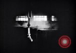 Image of drawing steel rod through die into wires at factory United States USA, 1924, second 50 stock footage video 65675029554