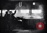 Image of drawing steel rod through die into wires at factory United States USA, 1924, second 51 stock footage video 65675029554