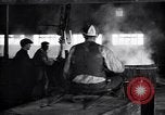 Image of drawing steel rod through die into wires at factory United States USA, 1924, second 55 stock footage video 65675029554