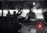 Image of drawing steel rod through die into wires at factory United States USA, 1924, second 56 stock footage video 65675029554