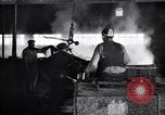 Image of drawing steel rod through die into wires at factory United States USA, 1924, second 58 stock footage video 65675029554