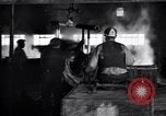 Image of drawing steel rod through die into wires at factory United States USA, 1924, second 62 stock footage video 65675029554