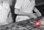 Image of wrapping lollipops United States USA, 1931, second 32 stock footage video 65675029570