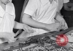 Image of wrapping lollipops United States USA, 1931, second 33 stock footage video 65675029570