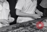 Image of wrapping lollipops United States USA, 1931, second 36 stock footage video 65675029570