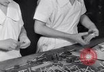 Image of wrapping lollipops United States USA, 1931, second 37 stock footage video 65675029570