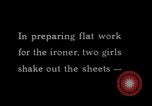 Image of machines iron bed sheets United States USA, 1931, second 4 stock footage video 65675029574
