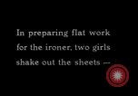 Image of machines iron bed sheets United States USA, 1931, second 5 stock footage video 65675029574