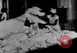 Image of machines iron bed sheets United States USA, 1931, second 9 stock footage video 65675029574