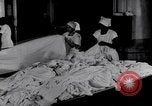 Image of machines iron bed sheets United States USA, 1931, second 10 stock footage video 65675029574