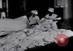 Image of machines iron bed sheets United States USA, 1931, second 11 stock footage video 65675029574