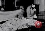 Image of machines iron bed sheets United States USA, 1931, second 12 stock footage video 65675029574