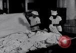 Image of machines iron bed sheets United States USA, 1931, second 13 stock footage video 65675029574