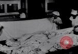 Image of machines iron bed sheets United States USA, 1931, second 16 stock footage video 65675029574