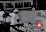 Image of machines iron bed sheets United States USA, 1931, second 20 stock footage video 65675029574