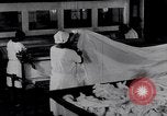 Image of machines iron bed sheets United States USA, 1931, second 23 stock footage video 65675029574